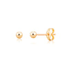 Gold stud earrings on a white background