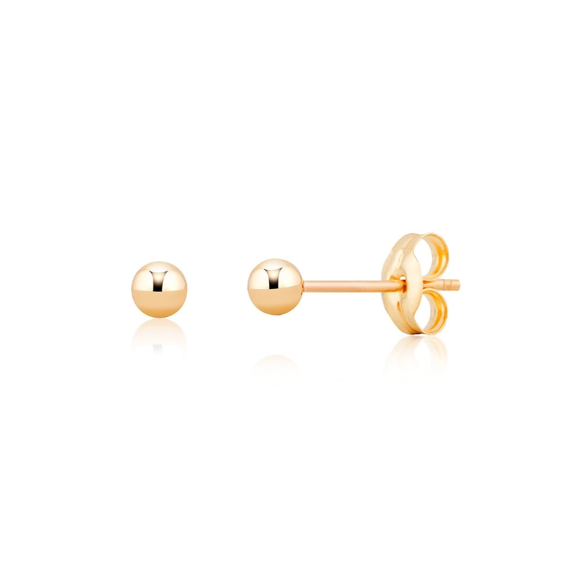 Gold stud earrings on a white background