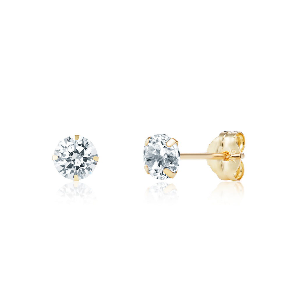 Pair of gold stud earrings with clear gemstones on a white background