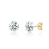 Gold stud earrings with clear gemstones on a white background
