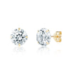 Pair of gold stud earrings with clear gemstones on a white background