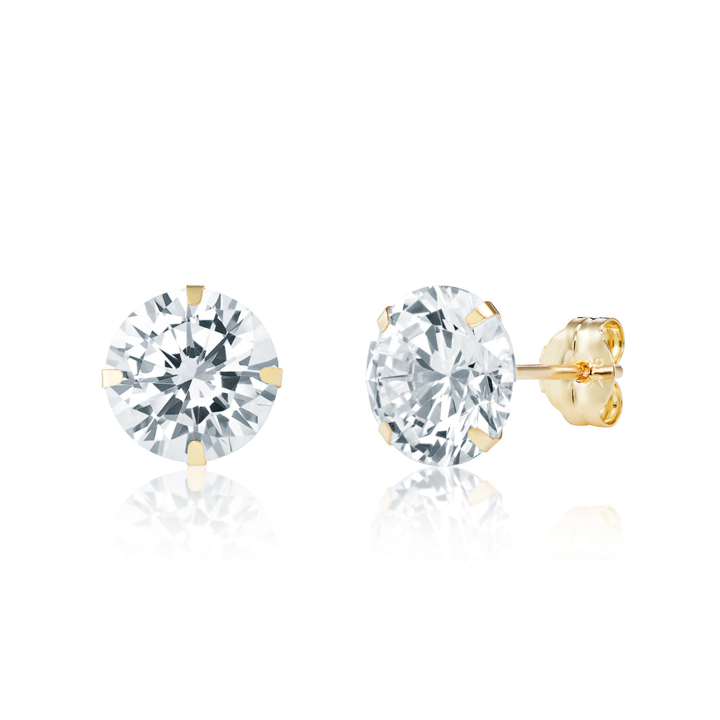 Pair of gold stud earrings with clear gemstones on a white background