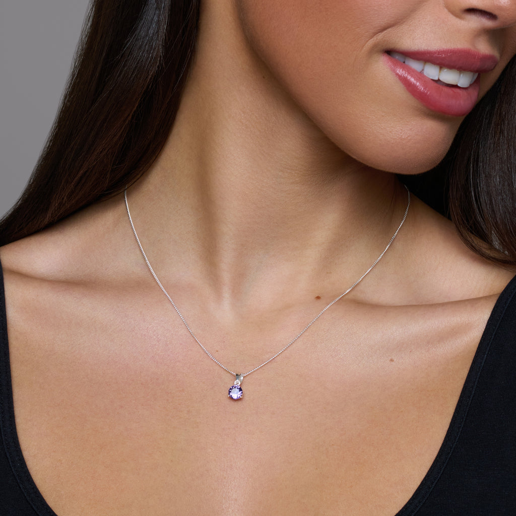 Purple gemstone necklace on a white background