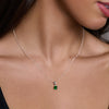 Silver necklace with a green pendant on a model