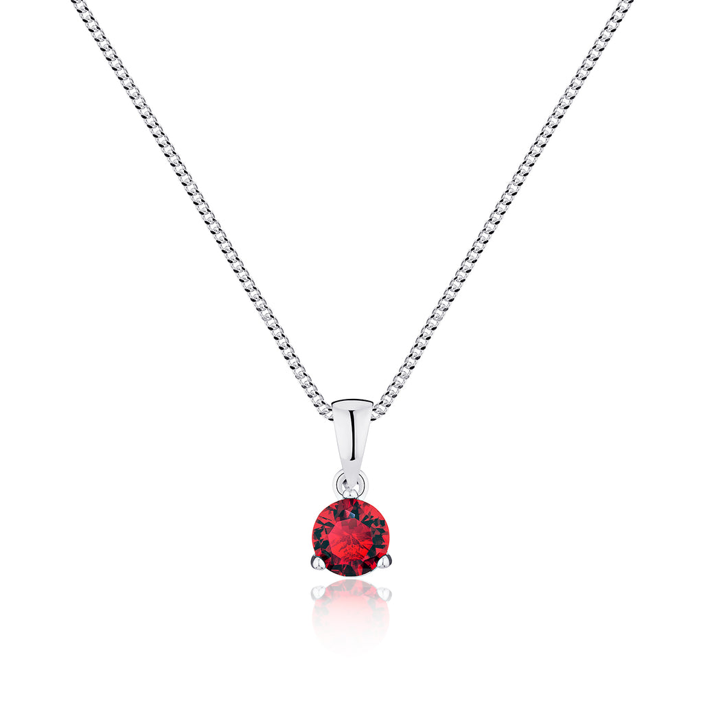Silver necklace with a red gemstone pendant on a white background