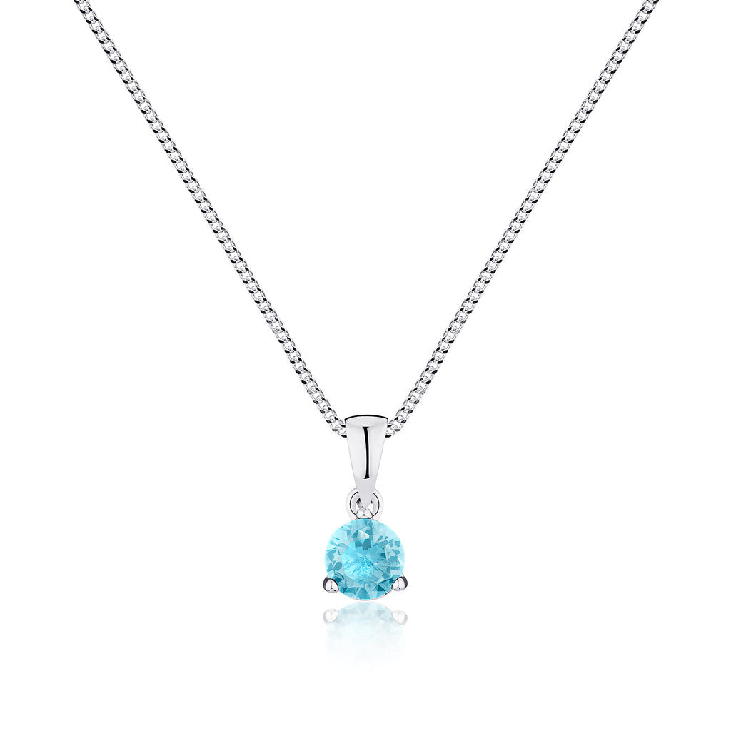 Silver necklace with a blue gemstone pendant on a white background