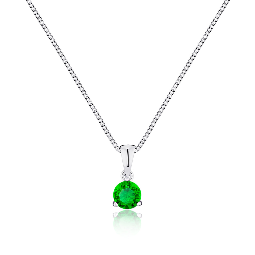 Silver necklace with a green gemstone pendant on a white background