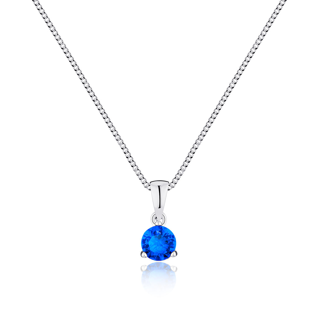 Silver necklace with a blue gemstone pendant on a white background